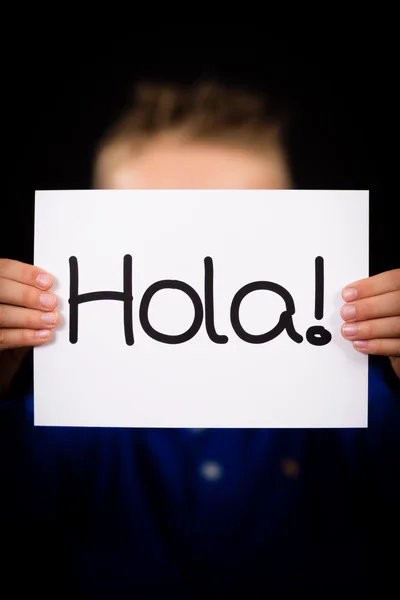 Child holding sign with Spanish word Hola - Hello — Stock Photo, Image