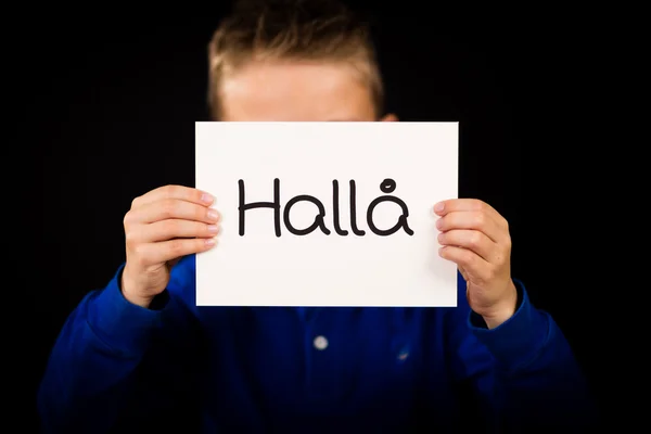Child holding sign with Swedish word Halla - Hello — Stock Photo, Image