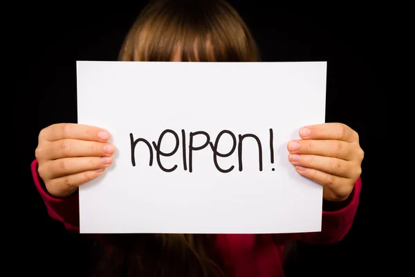 Kind houden teken met Nederlandse woord Helpen - Help — Stockfoto