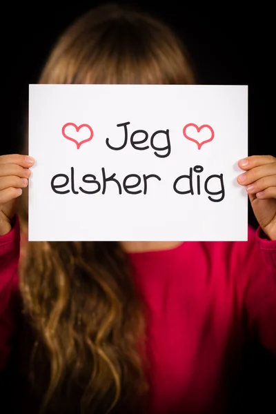 Dziecko trzyma znak z duńskim słowa Jeg Elsker Dig - kocham cię — Zdjęcie stockowe