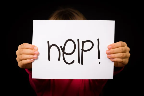 Child holding Help sign — Stock Photo, Image