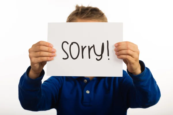 Çocuk holding özür işareti — Stok fotoğraf
