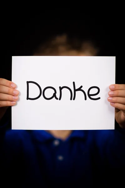 Child holding sign with German word Danke - Thank You — Stock Photo, Image