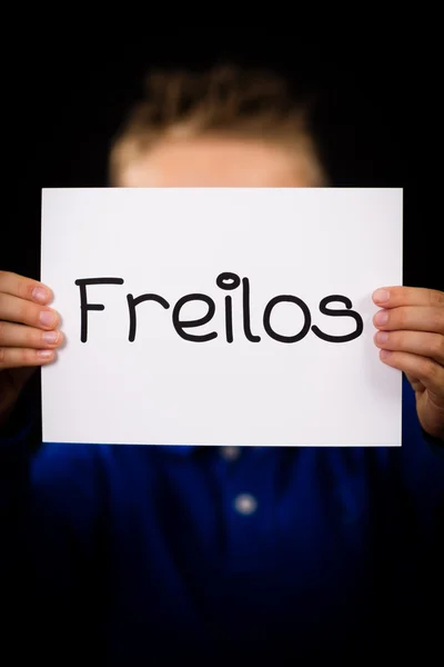 Child holding sign with German word Freilos - See You Later — Stock Photo, Image