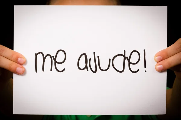 Child holding sign with Portuguese words Me Ajude - Help Me — Stock Photo, Image