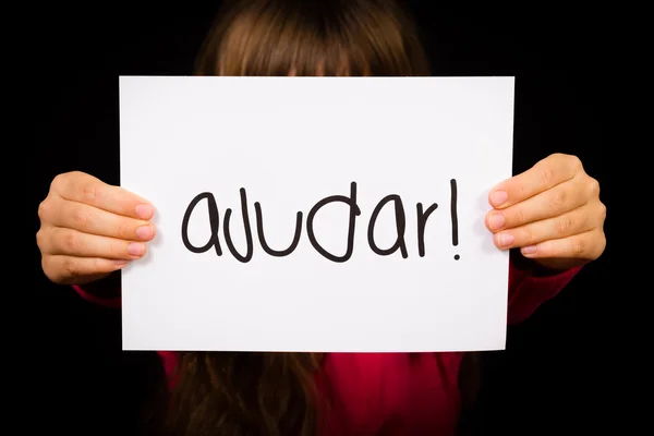 Child holding sign with Portuguese word Ajudar - Help — Stock Photo, Image