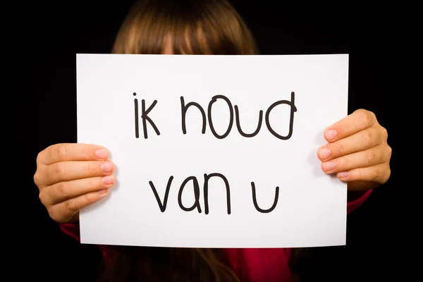 Child holding sign with Dutch words Ik Houd Van U - I Love You — Stock Photo, Image