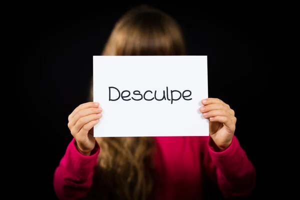 Child holding sign with Portuguese word Desculpe - Sorry — Stock Photo, Image