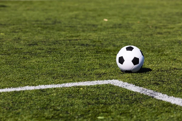 Green pitch with soccer ball — Stock Photo, Image