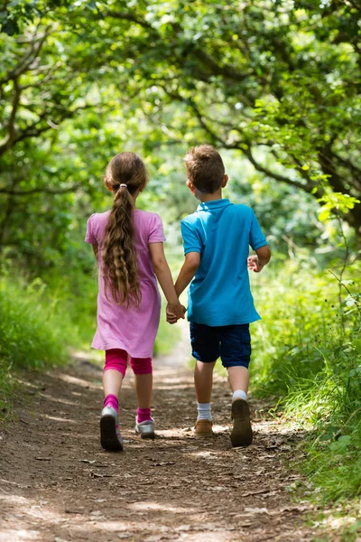 Walking boy and girl — Stock Photo, Image