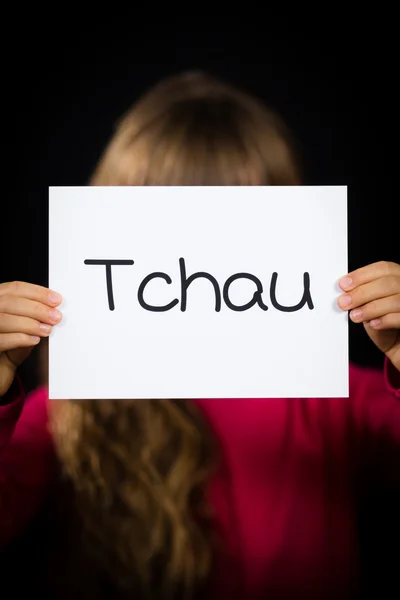 Το παιδί κρατάει πινακίδα με την πορτογαλική λέξη Tchau - See You Later — Φωτογραφία Αρχείου