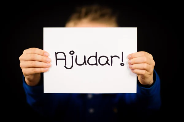 Child holding sign with Portuguese word Ajudar - Help — Stock Photo, Image