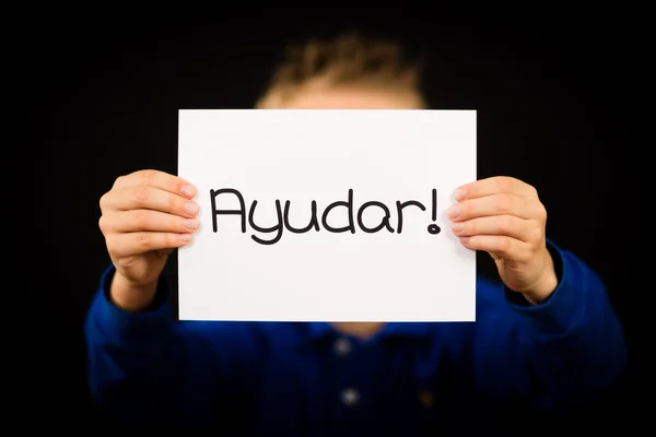 Kind houden teken met Spaanse woord Ayudar - Help — Stockfoto