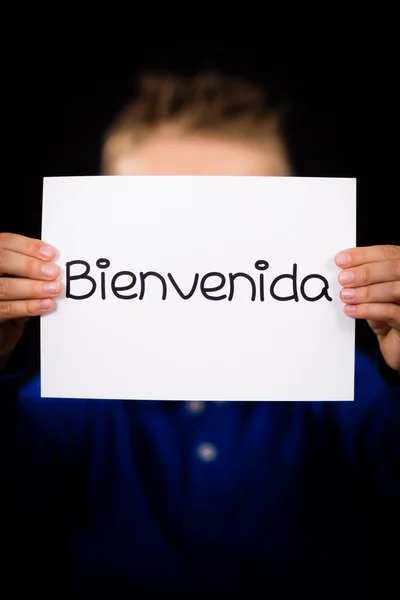 Child holding sign with Spanish word Bienvenida - Welcome — Stock Photo, Image