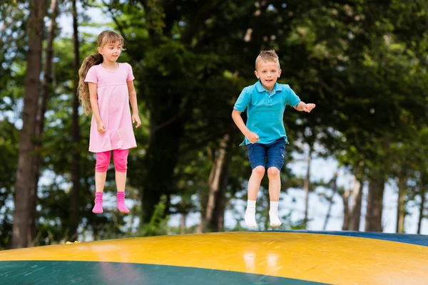 Kids at bouncy pillow — Stock Photo, Image