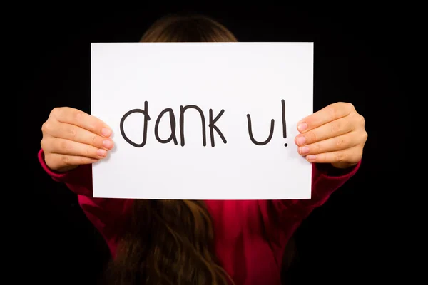 Child holding sign with Dutch words Dank U - Thank You — Stock Photo, Image