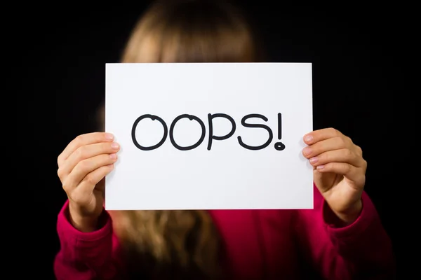 Child holding OOPS sign — Stock Photo, Image
