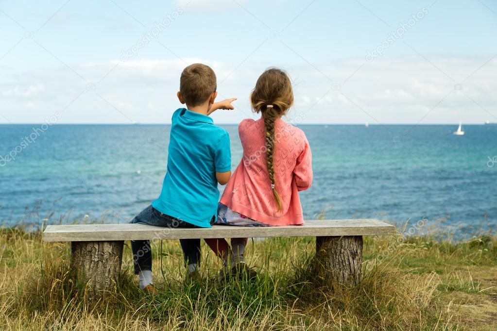 Kids overlooking the ocean