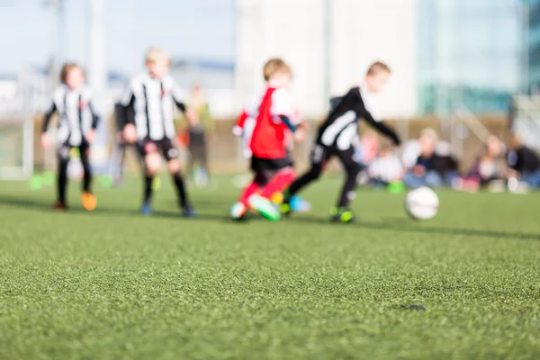 Blur of boys playing soccer — Stock Photo, Image