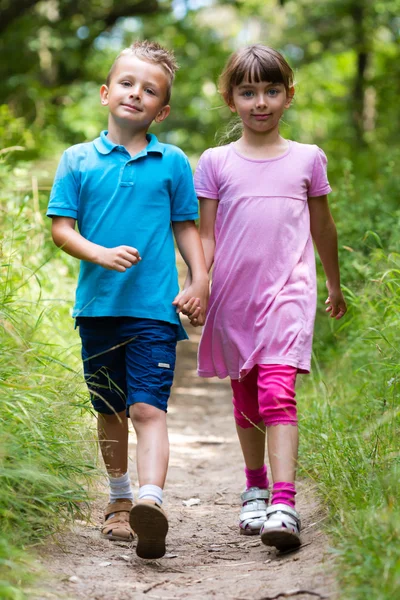Walking boy and girl — Stock Photo, Image