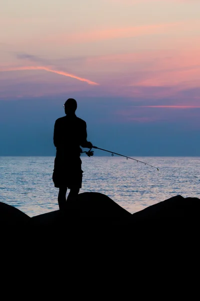 Silhouette of fisherman — Stock Photo, Image