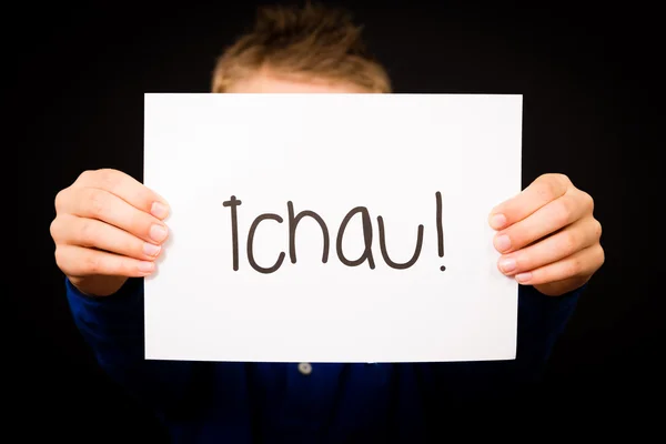 Child holding sign with Portuguese word Tchau - See You Later — Stock Photo, Image
