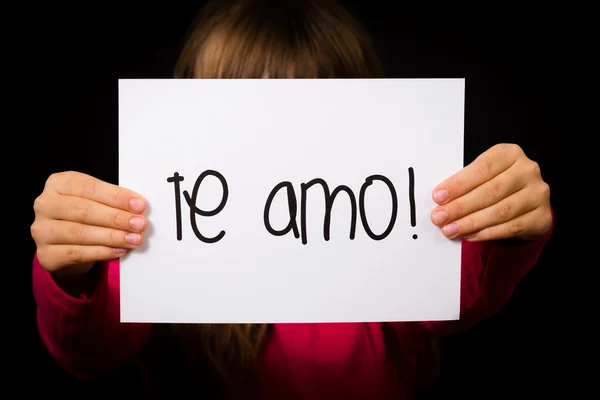 Dítě drží ceduli s španělská slova Te Amo - I Love You — Stock fotografie