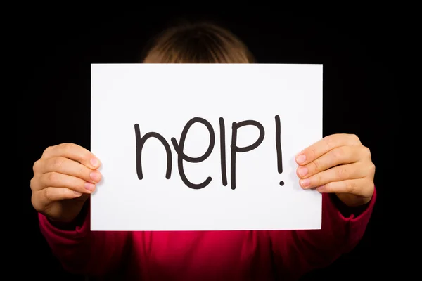 Child holding Help sign — Stock Photo, Image