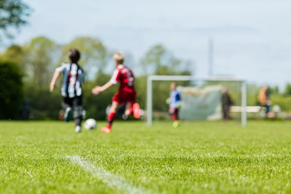 Blurred kids playing soccer match — Stock Photo, Image