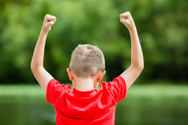 Boy with raised arms — Stock Photo, Image