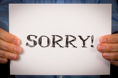 Adam özür işareti ile