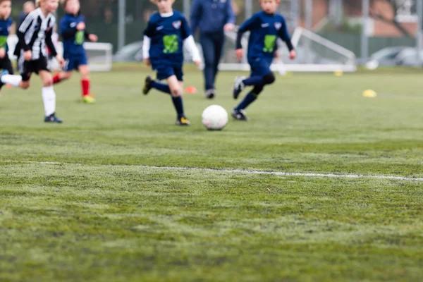 Blurred kids playing soccer — Stock Photo, Image