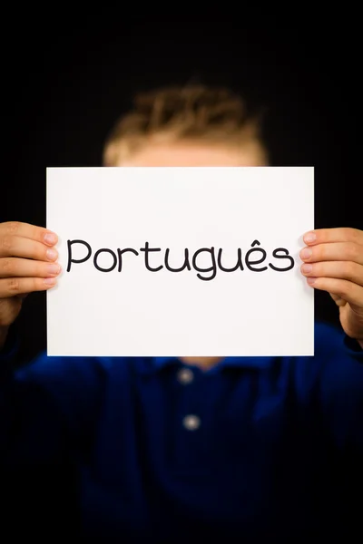 Criança segurando sinal com a palavra portuguesa Portugues - Português i — Fotografia de Stock