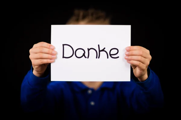 Child holding sign with German word Danke - Thank You — Stock Photo, Image