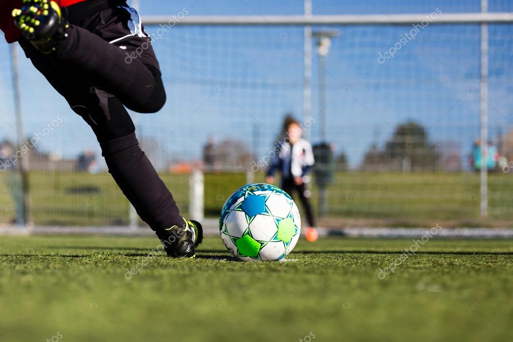 Soccer player and goalie during penalty shootout Stock Photo by