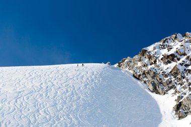 Off piste ski tracks on powder snow clipart