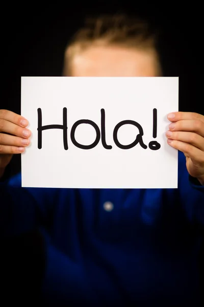 Child holding sign with Spanish word Hola - Hello — Stock Photo, Image