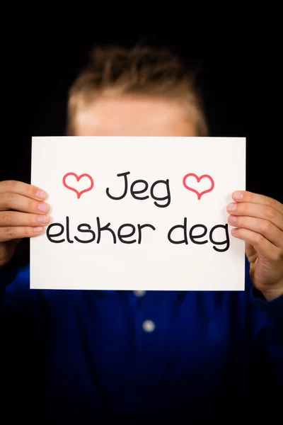 Dziecko trzyma znak z norweskim słowa Jeg Elsker Dig - kocham — Zdjęcie stockowe