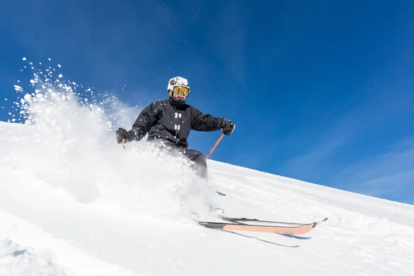 Male skier skiing at ski resort — Stock Photo, Image