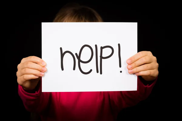 Child holding Help sign — Stock Photo, Image