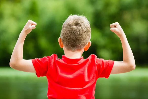 Happy boy with raised arms — Stock Photo, Image
