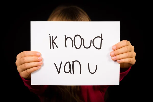 Dítě drží ceduli s holandským slova Ik Houd Van U - I Love You — Stock fotografie