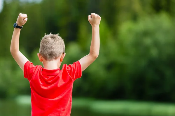 Boy with raised arms — Stock Photo, Image