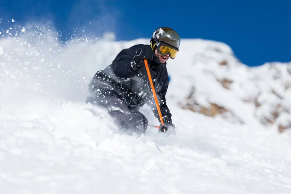 Skier skiing on ski slope — Stock Photo, Image