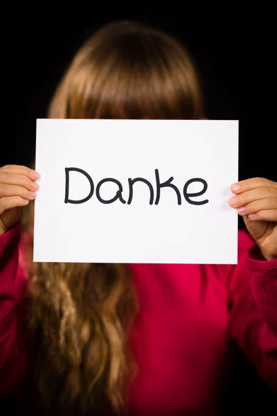 Child holding sign with German word Danke - Thank You — Stock Photo, Image