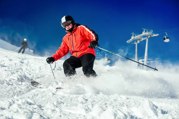 Skier skiing on ski slope — Stock Photo, Image