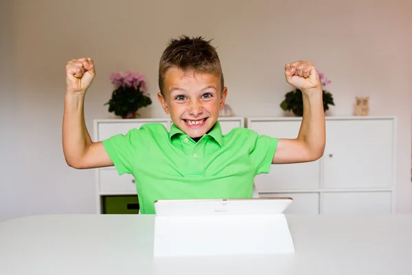Happy boy using white tablet — Stock Photo, Image