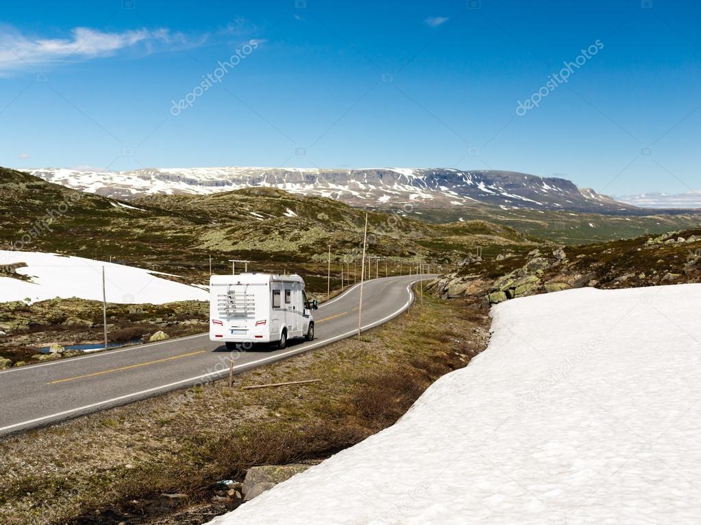 Campervan driving on Hardangervidda road in Norway