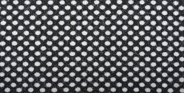 Dark knitted fabric with white polka dots, background — Stock Photo, Image