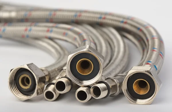 Flexible hoses for plumbing work — Stock Photo, Image